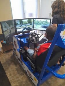 Waylon practices his driving on a simulator, a key step in developing his independence
